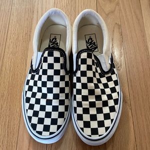 Vans classic checkerboard white and black slip-on shoes.